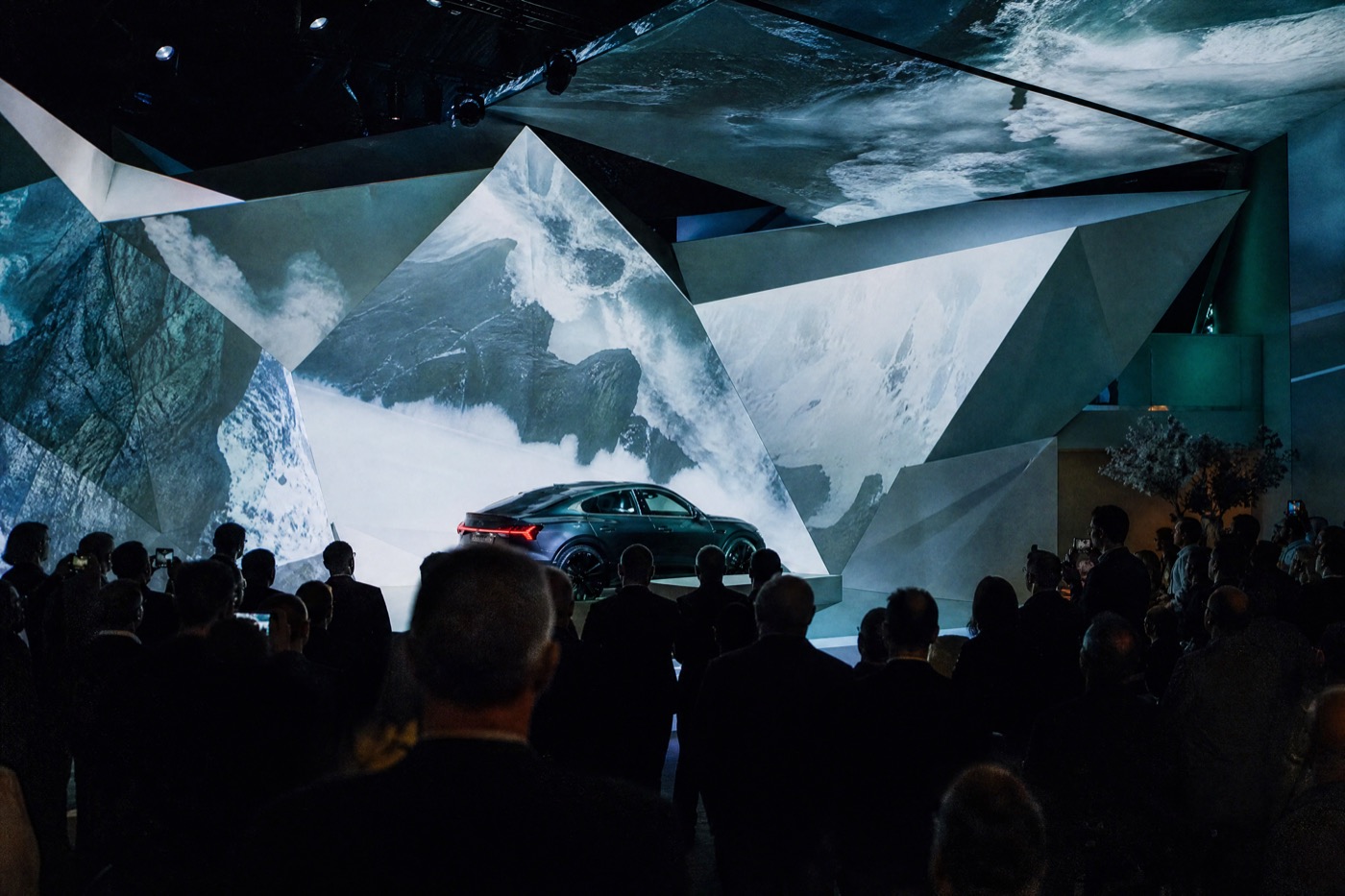 Car launch with video projected onto faceted panels around the set