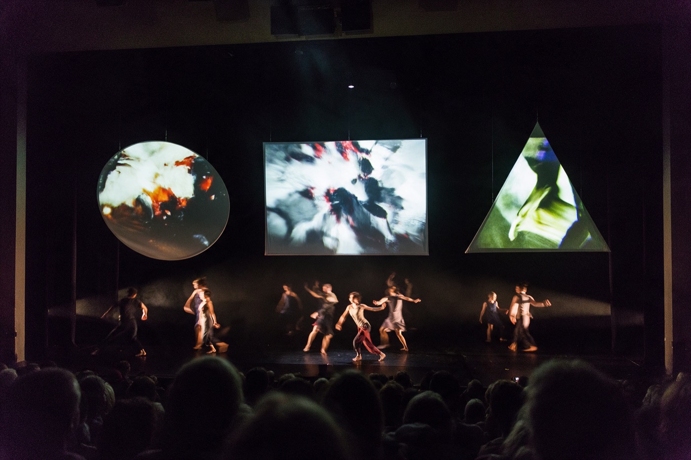Dance show with video projected only onto a hanging ellipse, rectangle and triangle